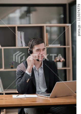 Handsome well dressed businessman working at his office, businessman working on a project Handsome well dressed businessman working at his office, businessman working on a project 113074779