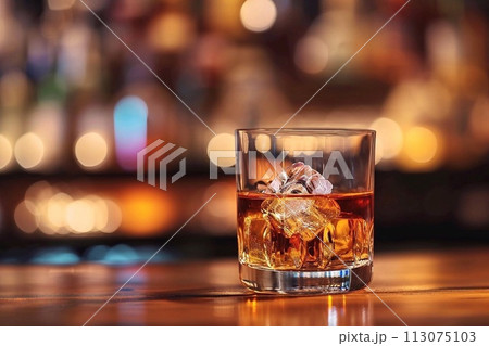 A glass of whiskey with ice A glass of whiskey with ice 113075103