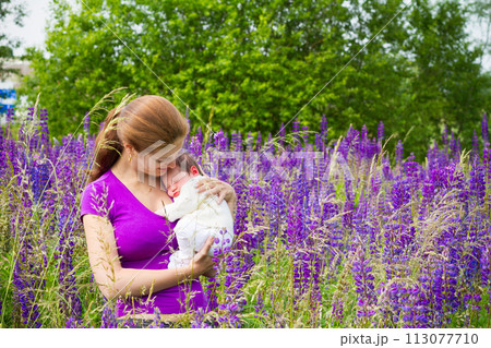 Mother and child in sunny park. Mom and baby. Mother and child in sunny park. Mom and baby. 113077710