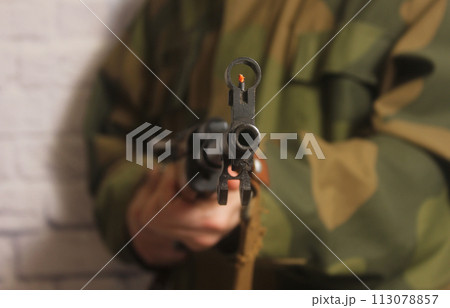 Man Holding SKS 7.62 x 39mm Military Weapon 113078857