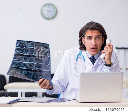 Young male doctor radiologist working in the clinic Young male doctor radiologist working in the clinic 113079065