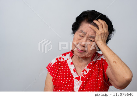 Depressed Asian senior woman lonely disappointed and lose memory in isolated white background. Portrait old woman ill sick depression disease feel sad and unhappy, dementia, health problems concept. Depressed Asian senior woman lonely disappointed and lose memory in isolated white background. Portrait old woman ill sick depression disease feel sad and unhappy, dementia, health problems concept. 113079640