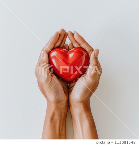 Hands holding red heart on white background. Health care or donate concept. World heart day Hands holding red heart on white background. Health care or donate concept. World heart day 113081348