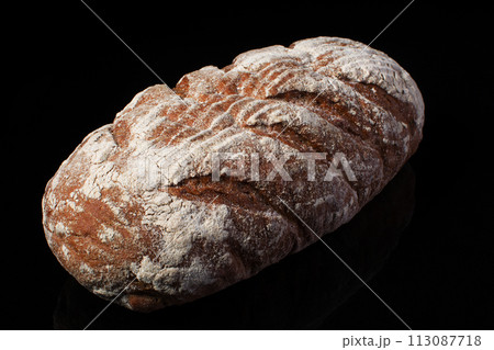 Bread on a dark background.Loaf Bread on a dark background.Loaf 113087718