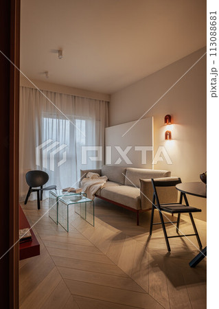 Living room with couch, table, and chairs in a house 113088681