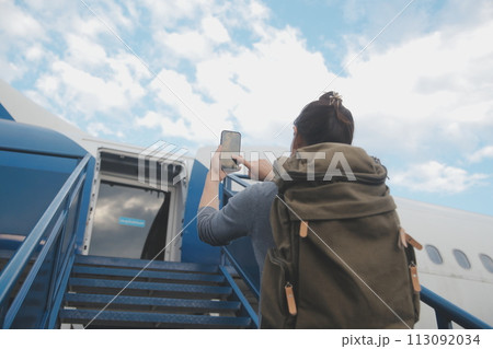 Happy attractive asian woman traveler with backpack at the modern airport terminal, copy space, Tourist journey trip concept Happy attractive asian woman traveler with backpack at the modern airport terminal, copy space, Tourist journey trip concept 113092034