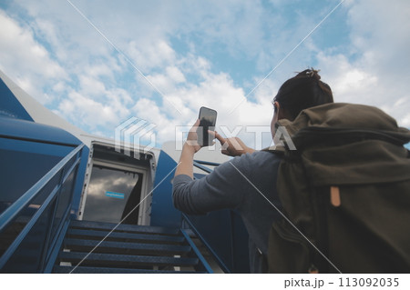 Happy attractive asian woman traveler with backpack at the modern airport terminal, copy space, Tourist journey trip concept 113092035