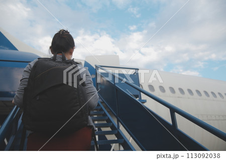 Happy attractive asian woman traveler with backpack at the modern airport terminal, copy space, Tourist journey trip concept 113092038