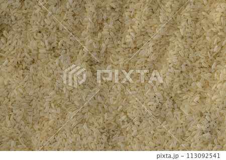 yellow peeled rice in close-up, uncooked 113092541