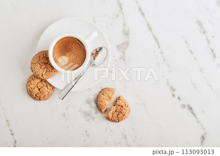 Cup of espresso coffee with amaretti cookie 113093013