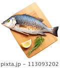 A side view of a grilled whole fish, showcasing its crispy skin and flaky flesh, 113093202