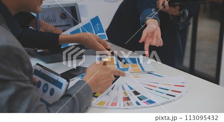 Close up ux developer and ui designer use augmented reality brainstorming about mobile app interface wireframe design on desk at modern office.Creative digital development agency Close up ux developer and ui designer use augmented reality brainstorming about mobile app interface wireframe design on desk at modern office.Creative digital development agency 113095432