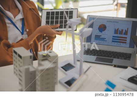Electrical engineer with businessman discussing new project installation solar cell panel on the roof of building. Alternative energy concept. Electrical engineer with businessman discussing new project installation solar cell panel on the roof of building. Alternative energy concept. 113095478