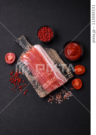 Fresh raw bacon sliced with spices and herbs 113095531
