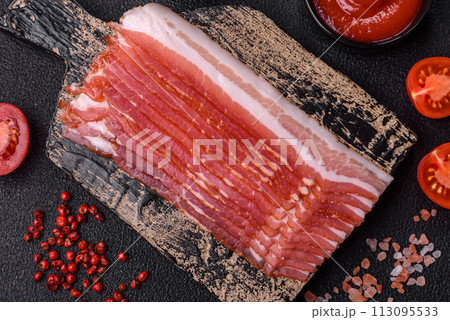 Fresh raw bacon sliced with spices and herbs Fresh raw bacon sliced with spices and herbs 113095533