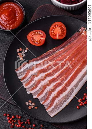 Fresh raw bacon sliced with spices and herbs Fresh raw bacon sliced with spices and herbs 113095601