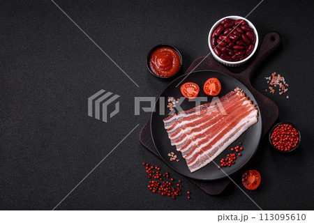 Fresh raw bacon sliced with spices and herbs Fresh raw bacon sliced with spices and herbs 113095610