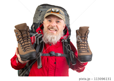 Tourist advertises and shows trekking boots. Clothing for tourism and travel 113096131