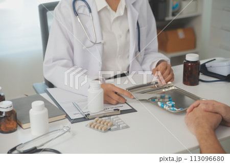 Healthcare service and pharmacy worker with customer at store counter for medication explanation. Pharmaceutical advice and opinion of pharmacist helping girl with medicine information. 113096680