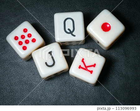 A Straight on poker dices on a black background. Close-up 113096993