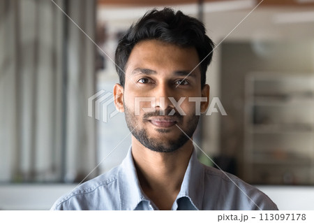 Positive handsome young Indian man head shot front portrait Positive handsome young Indian man head shot front portrait 113097178