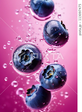 Flying or floating blueberry in pink water, with water splashes and drops. Close up 113097475