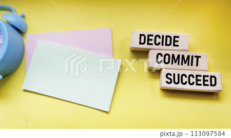 Decide Commit Succeed concept word on wooden blocks. Stickers for writing.  113097584