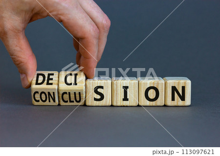 Decision or conclusion symbol. Businessman turns wooden cubes and changes the word 'conclusion' to 'decision'. Beautiful grey background. Business, decision or conclusion concept. Copy space. 113097621