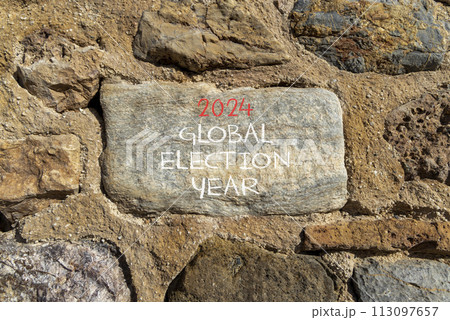 2024 global election year symbol. Concept words 2024 global election year on beautiful big grey stone. Beautiful stone wall background. Business 2024 global election year concept. Copy space 2024 global election year symbol. Concept words 2024 global election year on beautiful big grey stone. Beautiful stone wall background. Business 2024 global election year concept. Copy space 113097657