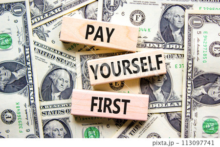 Pay yourself first symbol. Concept words Pay yourself first on beautiful wooden blocks. Dollar bills. Beautiful dollar bills background. Business and pay yourself first concept. Copy space. Pay yourself first symbol. Concept words Pay yourself first on beautiful wooden blocks. Dollar bills. Beautiful dollar bills background. Business and pay yourself first concept. Copy space. 113097741