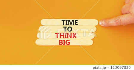 Time to think big symbol. Concept words Time to think big on wooden stick. Beautiful orange table orange background. Businessman hand. Business and time to think big concept. Copy space. Time to think big symbol. Concept words Time to think big on wooden stick. Beautiful orange table orange background. Businessman hand. Business and time to think big concept. Copy space. 113097820