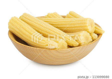 Pickled young baby corn cobs in wooden bowl isolated on white background 113099080