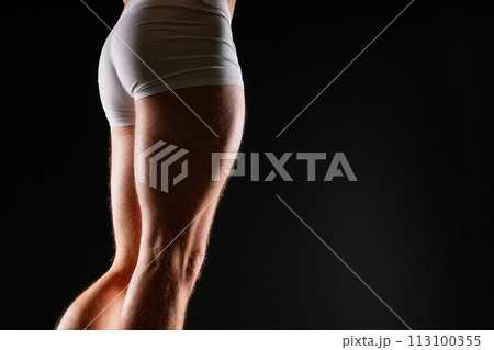 Male muscular legs body-building, muscle man in white sport panties 113100355