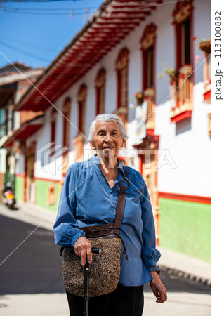 Senior woman tourist at the beautiful heritage town of Salamina in the department of Caldas in Colombia 113100882