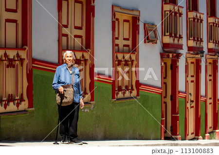 Senior woman tourist at the beautiful heritage town of Salamina in the department of Caldas in Colombia 113100883