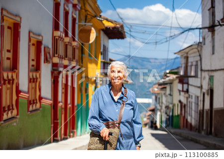 Senior woman tourist at the beautiful heritage town of Salamina in the department of Caldas in Colombia 113100885