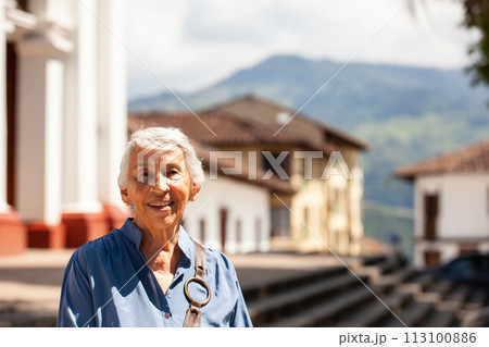 Senior woman tourist at the beautiful heritage town of Salamina in the department of Caldas in Colombia 113100886