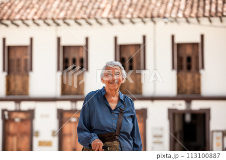 Senior woman tourist at the beautiful heritage town of Salamina in the department of Caldas in Colombia 113100887
