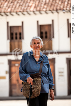 Senior woman tourist at the beautiful heritage town of Salamina in the department of Caldas in Colombia 113100888