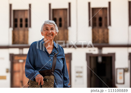 Senior woman tourist at the beautiful heritage town of Salamina in the department of Caldas in Colombia 113100889