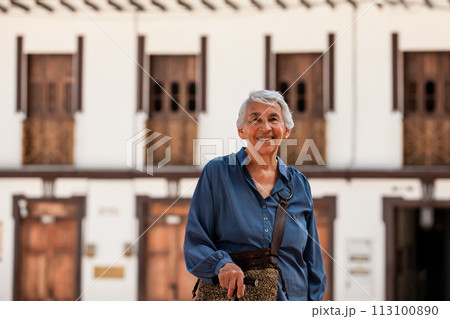Senior woman tourist at the beautiful heritage town of Salamina in the department of Caldas in Colombia 113100890