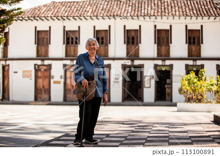 Senior woman tourist at the beautiful heritage town of Salamina in the department of Caldas in Colombia 113100891