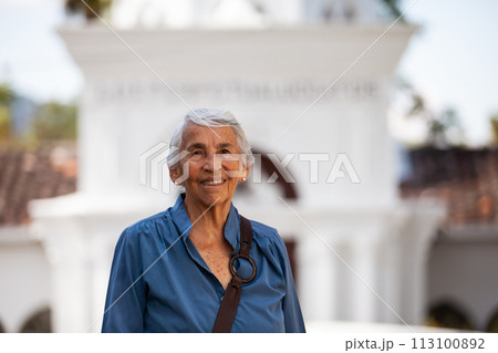 Senior woman tourist at the beautiful heritage town of Salamina in the department of Caldas in Colombia 113100892