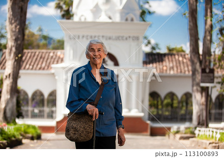 Senior woman tourist at the beautiful heritage town of Salamina in the department of Caldas in Colombia 113100893