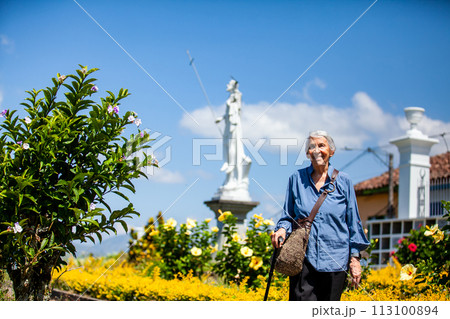 Senior woman tourist at the beautiful heritage town of Salamina in the department of Caldas in Colombia 113100894