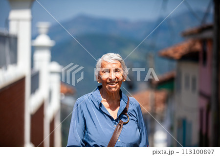 Senior woman tourist at the beautiful heritage town of Salamina in the department of Caldas in Colombia 113100897