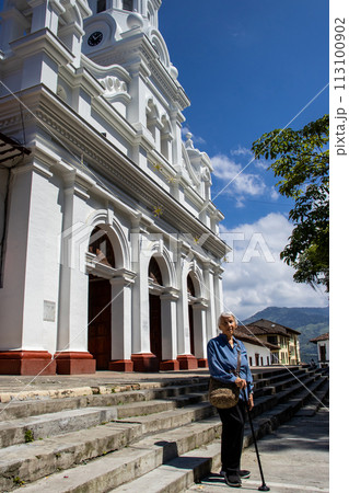 Senior woman tourist at the beautiful heritage town of Salamina in the department of Caldas in Colombia 113100902