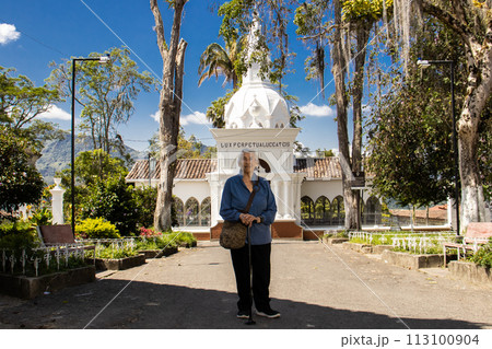 Senior woman tourist at the beautiful heritage town of Salamina in the department of Caldas in Colombia 113100904