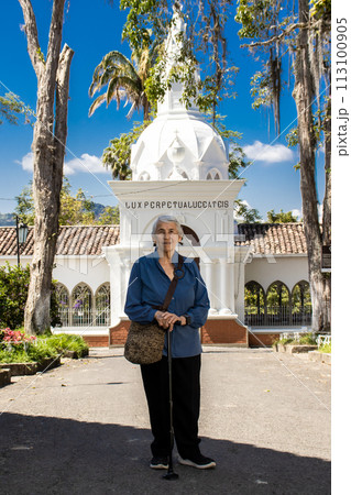 Senior woman tourist at the beautiful heritage town of Salamina in the department of Caldas in Colombia 113100905