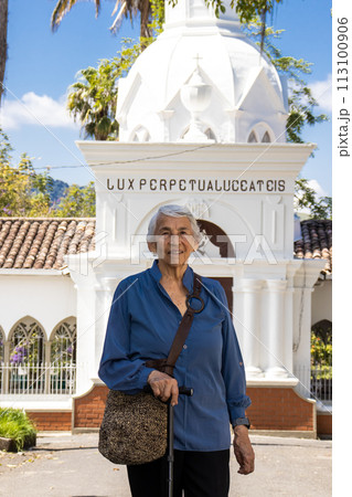 Senior woman tourist at the beautiful heritage town of Salamina in the department of Caldas in Colombia 113100906